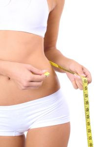 young woman measuring her body with tape-img-blog